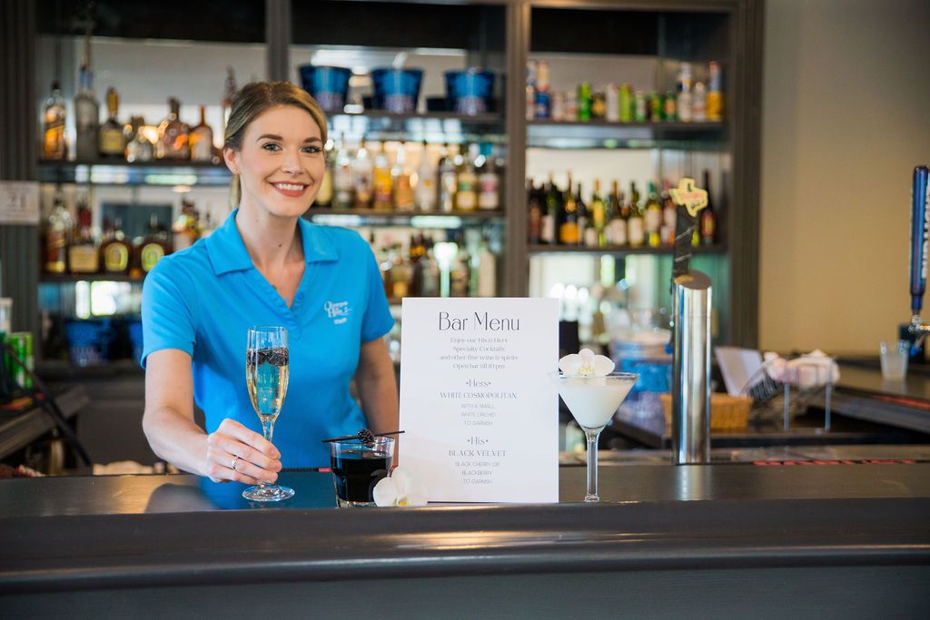 friendly staff serving a drink at the bar