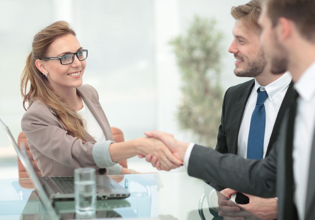 three people at a business meeting